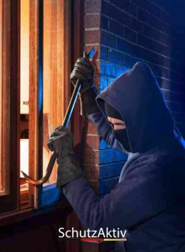Burglar Using Crowbar To Break Into a House at night with room l